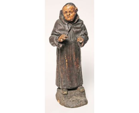 A Goldscheider earthenware figure formed as a monk, height 33cm, impressed marks to base. Condition - right hand missing, chi