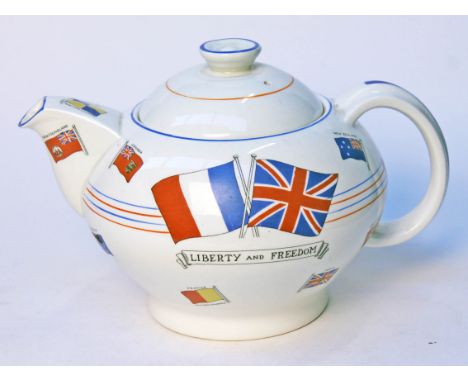 A Crown Ducal Liberty & Freedom Art Deco teapot inscribed 'War Against Hitlerism This Souvenir Teapot was made for Dyson & Ho