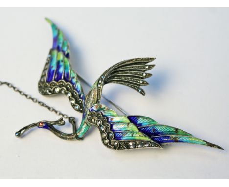 A silver enamel bird brooch, length 8.5cm. Condition - minor loss to enamel, otherwise ok.
