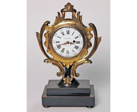 A French ormolu cartel clock, the enamel dial signed 'Etienne Lenoir' and the movement inscribed 'Gosselin AParis', supported