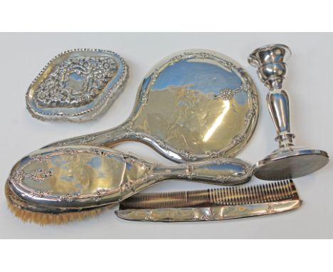 Hallmarked silver comprising a dressing table set, a silver topped glass box, together with a white metal candlestick.