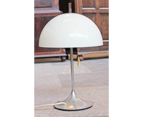 A 1970s table lamp having white plastic shade and aluminium tulip base. H49cm.