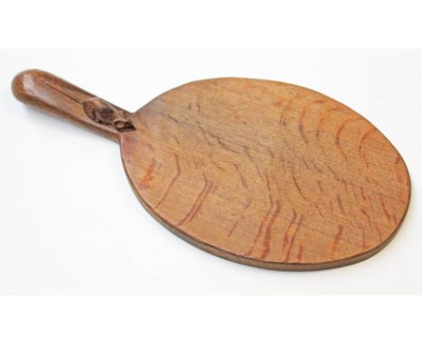 A Robert Thompson "Mouseman" carved oak cheese board, length 37.5cm.