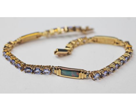 A 14k gold diamond opal and blue stone bracelet, length 17.5cm, gross wt.10g.