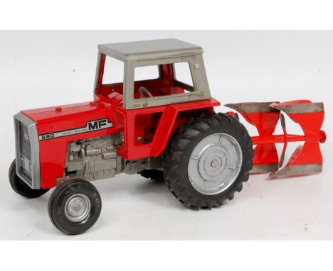 ERTL 1/16th scale model of a Massey Ferguson 590 Tractor, modified and fitted with a four furrow metal plough