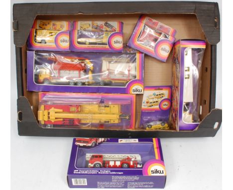 Collection of 11 Siku commercial and emergency services vehicles, some with damaged boxes and windows, examples to include No