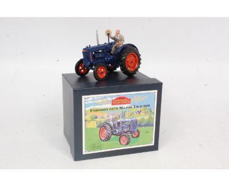Britains, 8715 Fordson E27N Major tractor, dark blue body with orange wheels, Henry Ford figure with cap, in the original lif