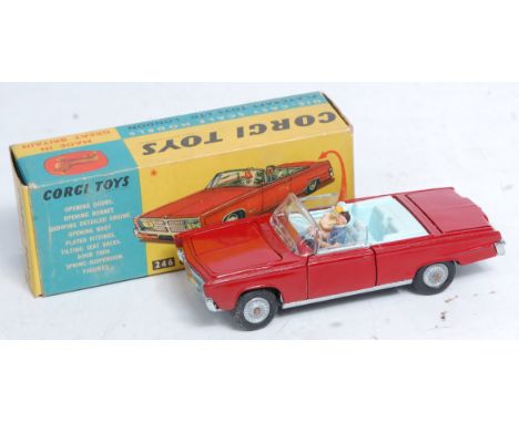 Corgi Toys, 246 Chrysler Imperial convertible, deep red body with light blue interior, with driver figure and golf trolley in