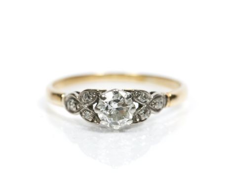 Diamond solitaire ring with brilliant cut stone with further diamond to shoulders