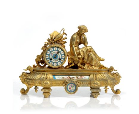 French gilt metal mantel clock 19th Century, with inset porcelain panels, 42cm across