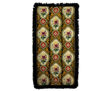 Russian tapestry rug on a black ground with foliate quatrefoil panels, 191cm x 83cm and five tapestry seat covers