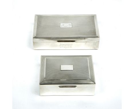 Two silver cigarette boxes with engine turned decoration (one monogrammed with presentation inscription)
