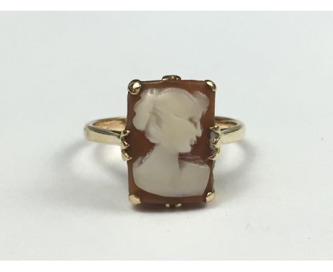 A vintage cameo dress ring, carved as the profile of a young lady, crown set on a 9ct gold shank