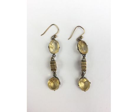 A pair of vintage yellow-metal, gilt white-metal and citrine ear pendants, each having an oval-cut stone suspended above a cu