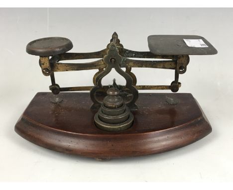 A set of 19th Century mahogany and brass postal scales and weights 