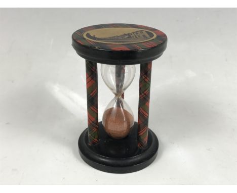 A Mauchline Tartan Ware egg timer, bearing a view of "High St, Grantown", 7.5 cm