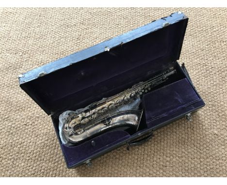 A vintage C G Conn silver-plated alto saxophone, serial M 947486, with initials T L and 1914 patent date, engraved Made by C 