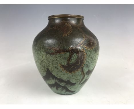 A WMF Ikora patinated brass vase, of inverted baluster form, decorated with dendritic tendrils and stylized blossom, 13.5 cm