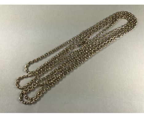 A late 19th Century yellow-metal guard chain, stamped 9ct, 26.7g