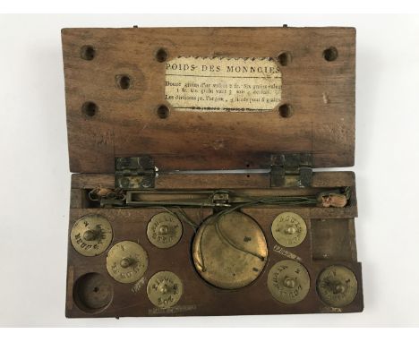 A Georgian wooden cased set of travelling beam scales, with paper label 'Poids des Monncies' [sic] (a/f)