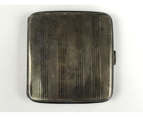 A George V silver cigarette case, having engine-turned and banded decoration, and an engraved monogram, Thomas William Lack, 