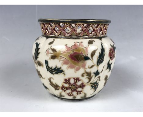 A Zsolnay Pecs diminutive vase, of lobed and inverted baluster form, having a reticulated rim and hand enamelled and gilded d