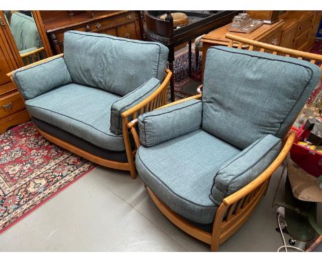 A Vintage Ercol Renaissance light wood framed two seat sofa and single chair. Designed with a blue/grey contemporary material