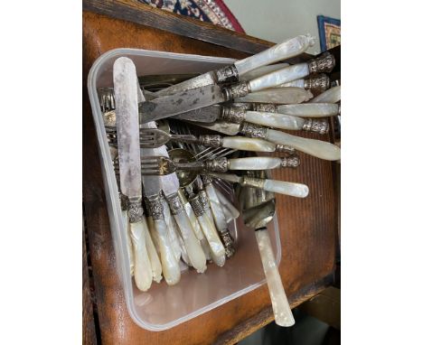 A Tub containing a quantity of mother of pearl handled cutlery. 