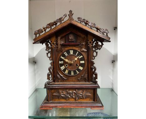 A 19th century Black Forest Gothic design mantel cuckoo clock by Black Forest clock maker Johann Baptist Beha. In a working c