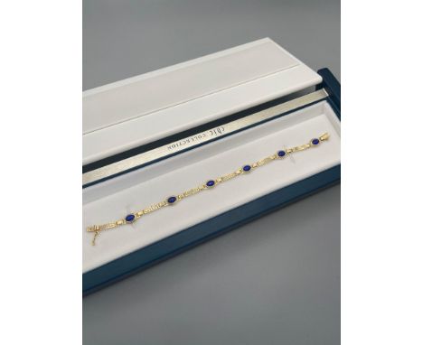 A Ladies vintage 14ct gold Greek Key bracelet designed with 6 Lapis Lazuli stones. [18cm length] [5.60 Grams] 