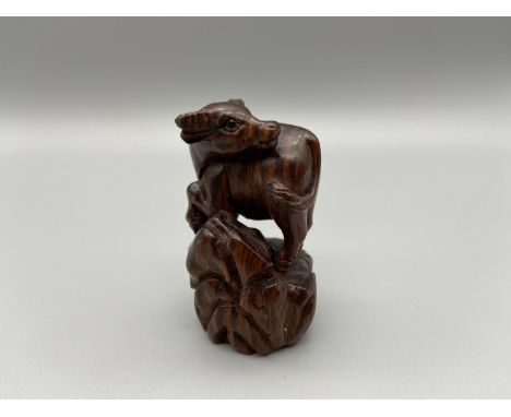 Japanese hand carved netsuke of an Ox detailed with black bead eyes, signed by the artist [5cm] 