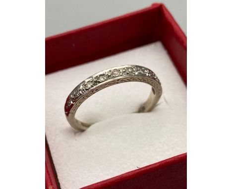 An 18ct white gold Albion Diamond band ring. Ring size 0, 10 Diamonds in a row. [2.90grams] 