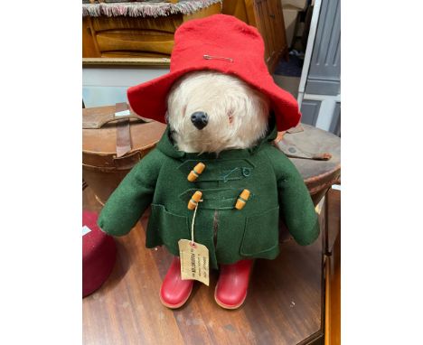 A Vintage Paddington bear teddy, Complete with original red wellies, green coat, red hat and tag. 