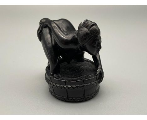 A Meiji period hand carved Japanese netsuke of a erotic  lady washing herself within a basin whilst a toad watches from behin