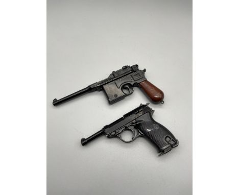 Two vintage Uniwerk Italy miniature toy pistols. 