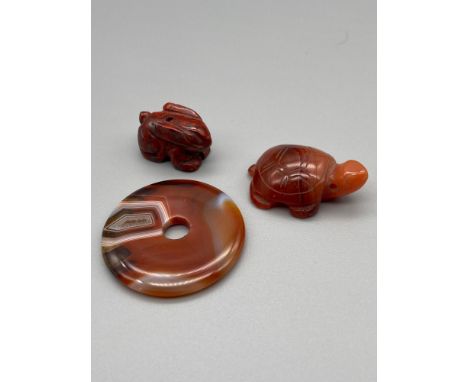 A Lot of three Chinese/ Japanese hand carved agate/ hard stone carvings/ sculptures. One is of a rabbit, Turtle and ring. [Ri