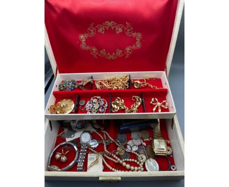 A Jewel box containing a quantity of jewellery and watches. Includes Casio Quartz watch, Avia Marine watch and various vintag