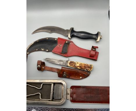 A Vintage Rolls Razor complete with pouch. Solingen hunting knife with deer head plastic grip with leather sheath. And a Germ
