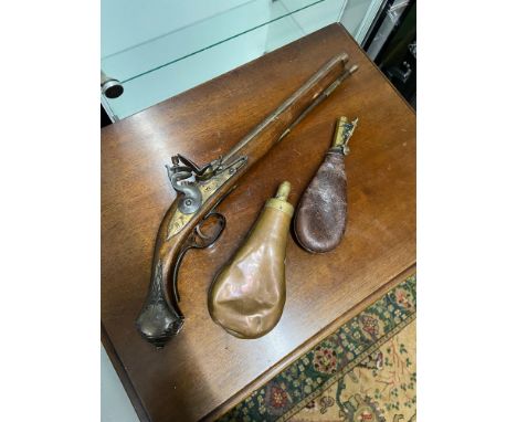 A Vintage reproduction flint lock pistol together with two antique powder flask. 