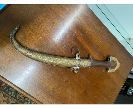 A Vintage Jambiya brass and wood dagger with sheath. 