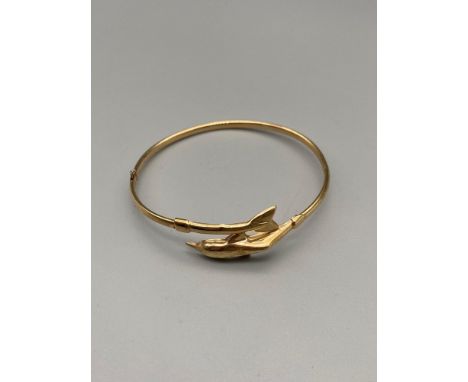A Ladies vintage 9ct gold dolphin bangle. [Weighs 3.89Grams] [6.5cm diameter] 