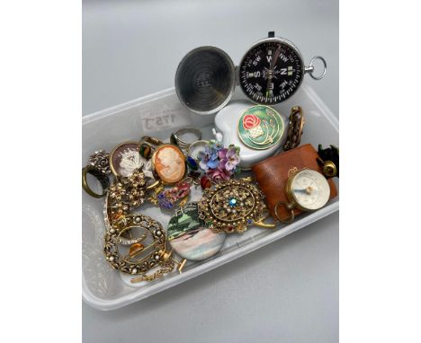 A Tub containing a quantity of mixed vintage jewellery. Includes two hand compasses. Ornate gem stone and possible silver rin