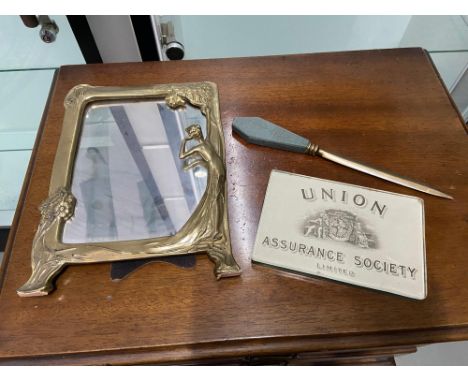 A Vintage Union Assurance Society Limited paper weight, Slate and bronze letter opener and An Art Nouveau brass picture frame