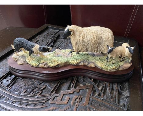 A Vintage Border Fine Arts figurine of a border coley herding sheep. Dated 1982, and signed Ayres. [30cm length] 