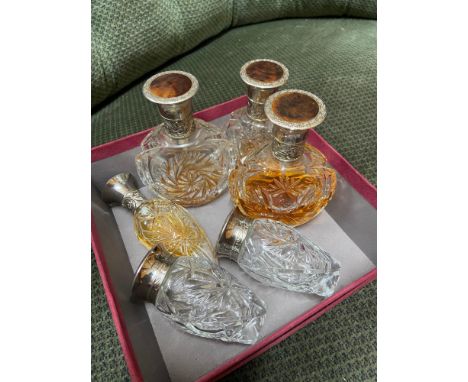 A Lot of 6 vintage cut glass perfume bottles with plastic caps. [Not plated] 