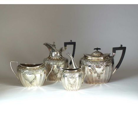 A George V four piece silver tea service, James Dixon &amp; Sons Ltd, Sheffield 1910, each piece of fluted form with chased s