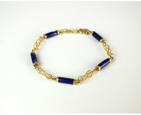A yellow metal and blue enamel bracelet, designed as five blue enamel tubular links each interspersed with five openwork styl