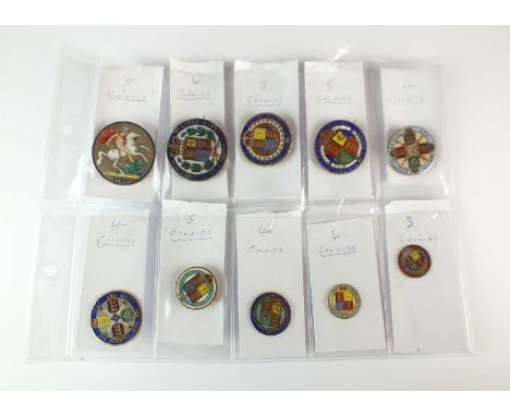 A collection of ten silver and polychrome enamel coins, comprising; two crowns dated 1821 and 1844 (converted to brooches), t