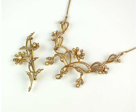 A late 19th/early 20th century seed pearl set necklace, designed as seed pearl set floral clusters mounted within seed pearl 
