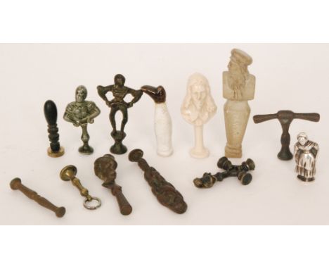 A collection of bronze and ceramic figural pipe tampers including a Continental example of a milkmaid marked .800 (qty)   